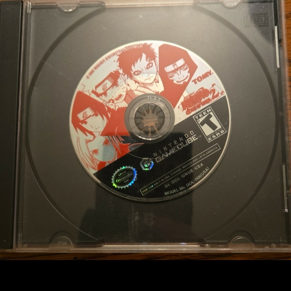 Nintendo GameCube Disc with Red, Black, White Character Art
